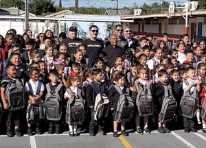 Purist Group Delivers 3000 Backpacks